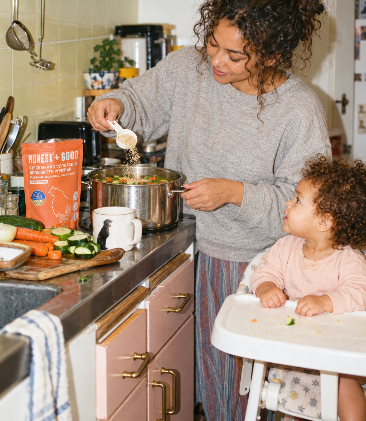 Cooking with Honest + Good Chicken + Vegetable Bone Broth Powder while a toddler watches